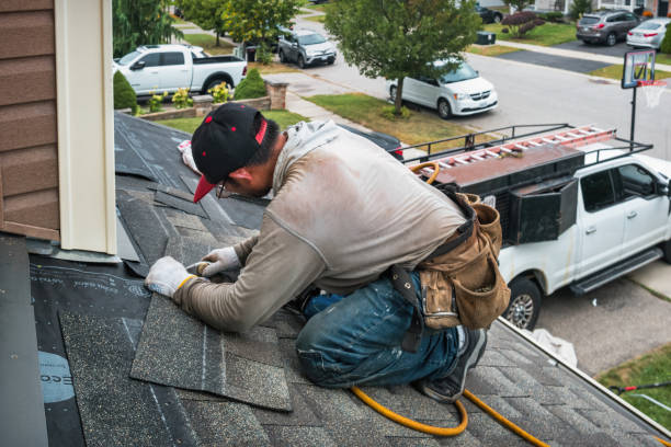 Professional Roofing technician working in Concord, MA